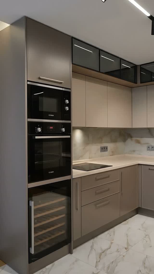 Modern kitchen with integrated microwave, oven, and wine cooler in taupe cabinetry.