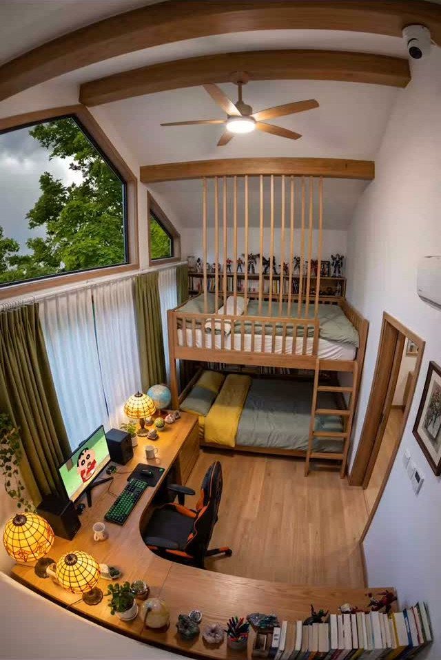 Wooden bunk beds and a built-in desk in a bright teen bedroom.