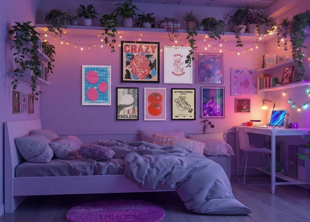 Purple teen bedroom with framed wall art, trailing plants, and a white desk.