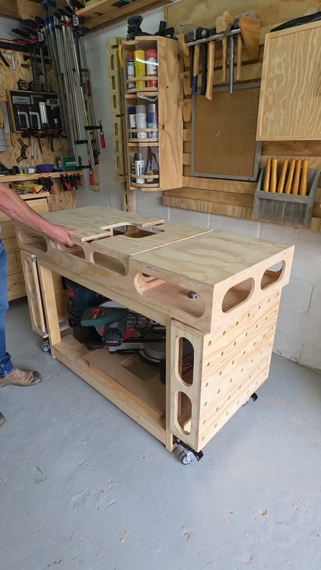 Wooden workbench on wheels with a thick top in a home workshop setting