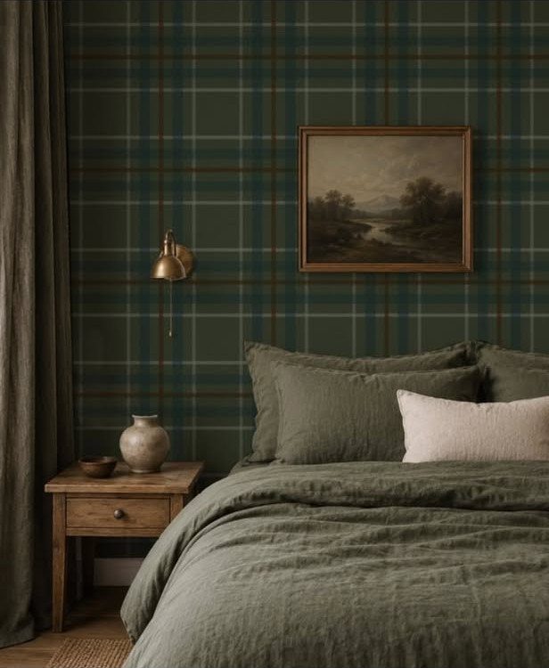 Dark green plaid wallpaper in a moody bedroom with olive green linen bedding.