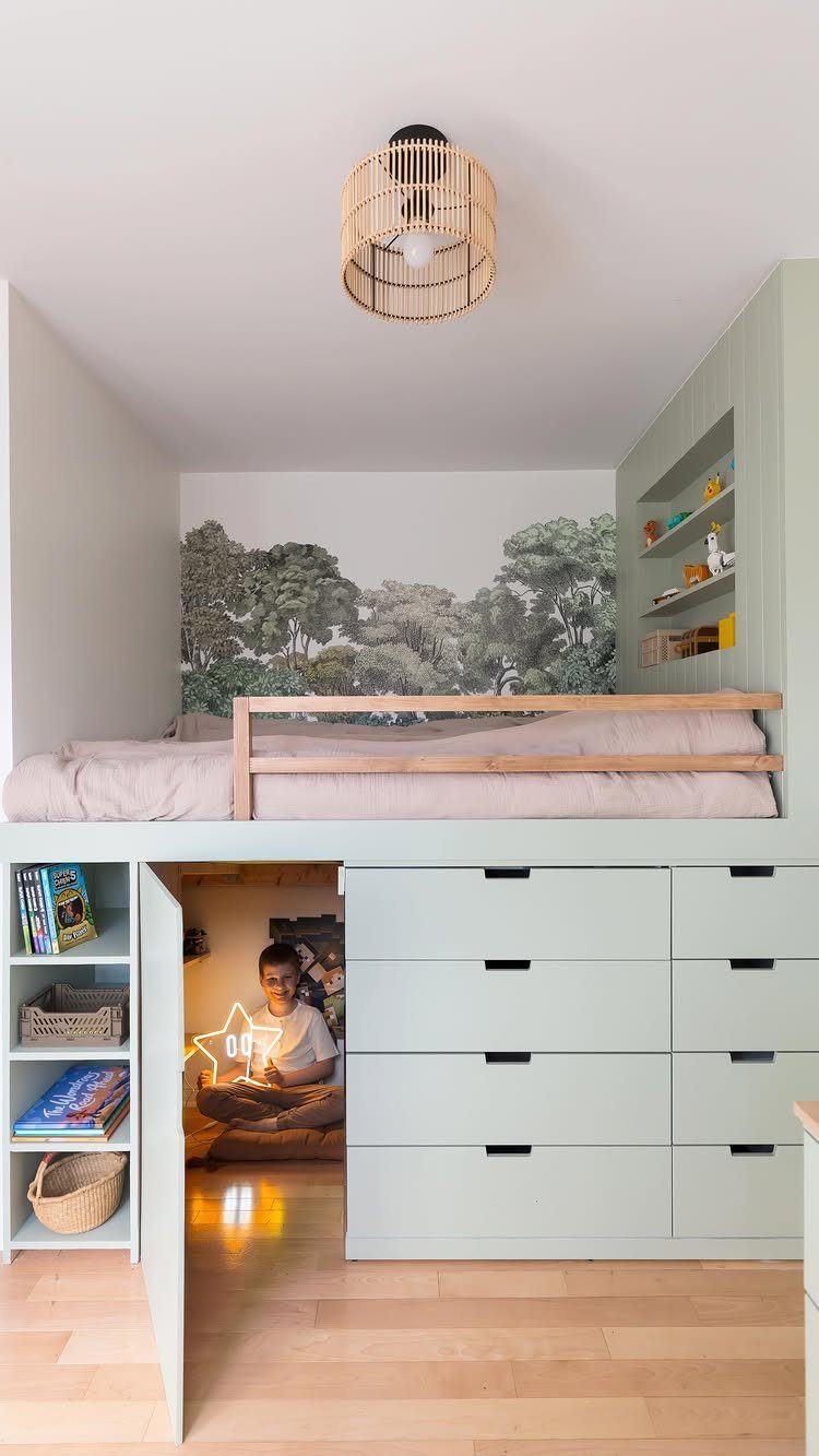 Loft bed with built-in storage drawers and a cozy reading nook underneath.