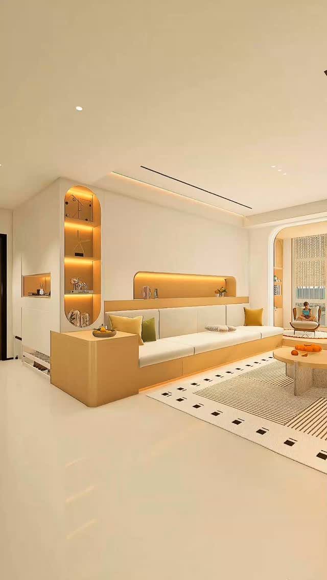 Modern built-in white sofa with light wood accents and recessed wall shelving.