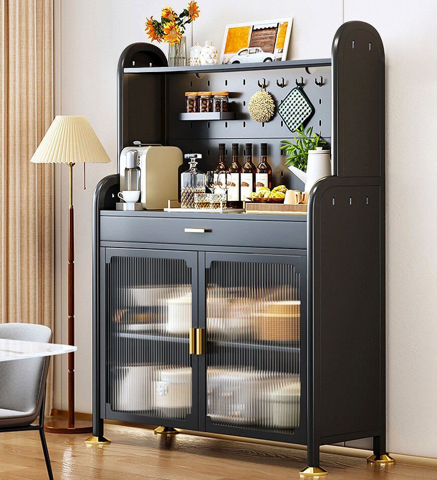 Dark grey kitchen cabinet with fluted glass doors and organized white storage bins inside.