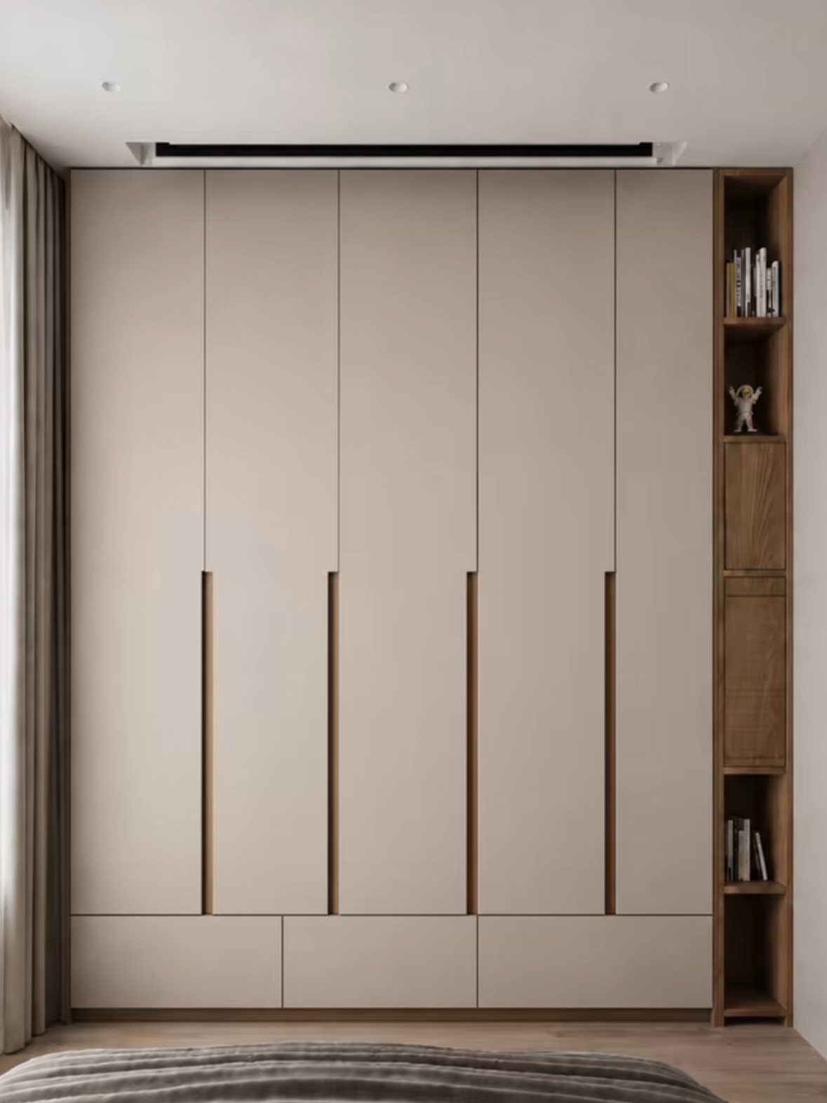 Beige floor-to-ceiling modular wardrobe with integrated wooden handles and an adjacent open bookshelf.